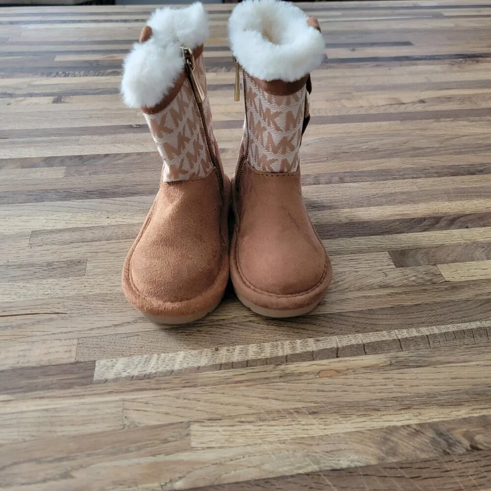 Michael Kors Yancy Girl Toddler boots featuring a brown logo print and faux fur